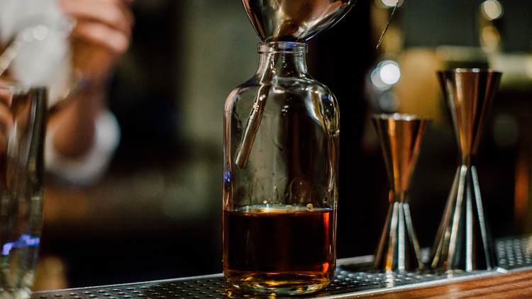 Bourbon Whisky bottle being filled